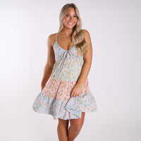 Woman wearing a floral dress on a white background