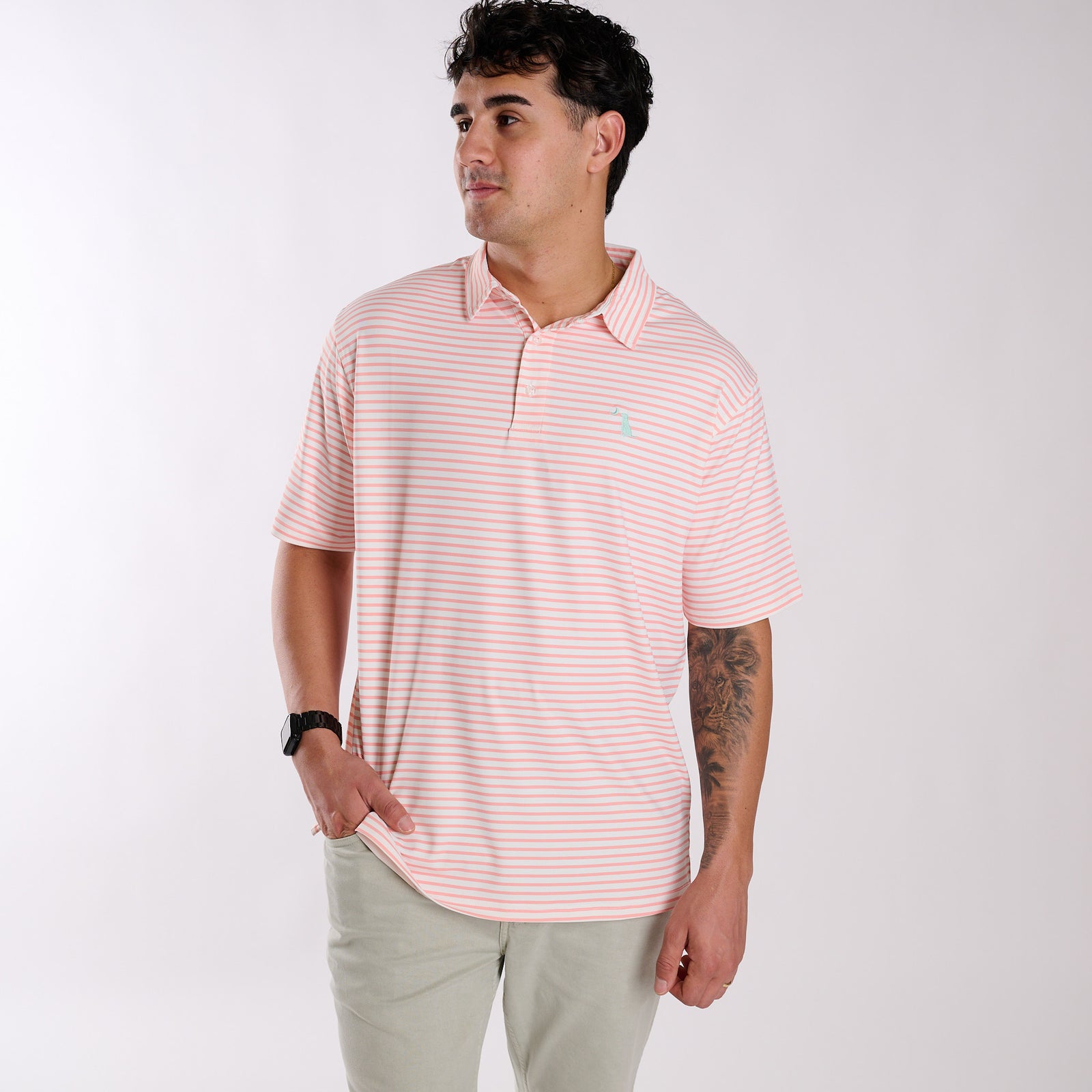 Man wearing a peach and white striped polo.