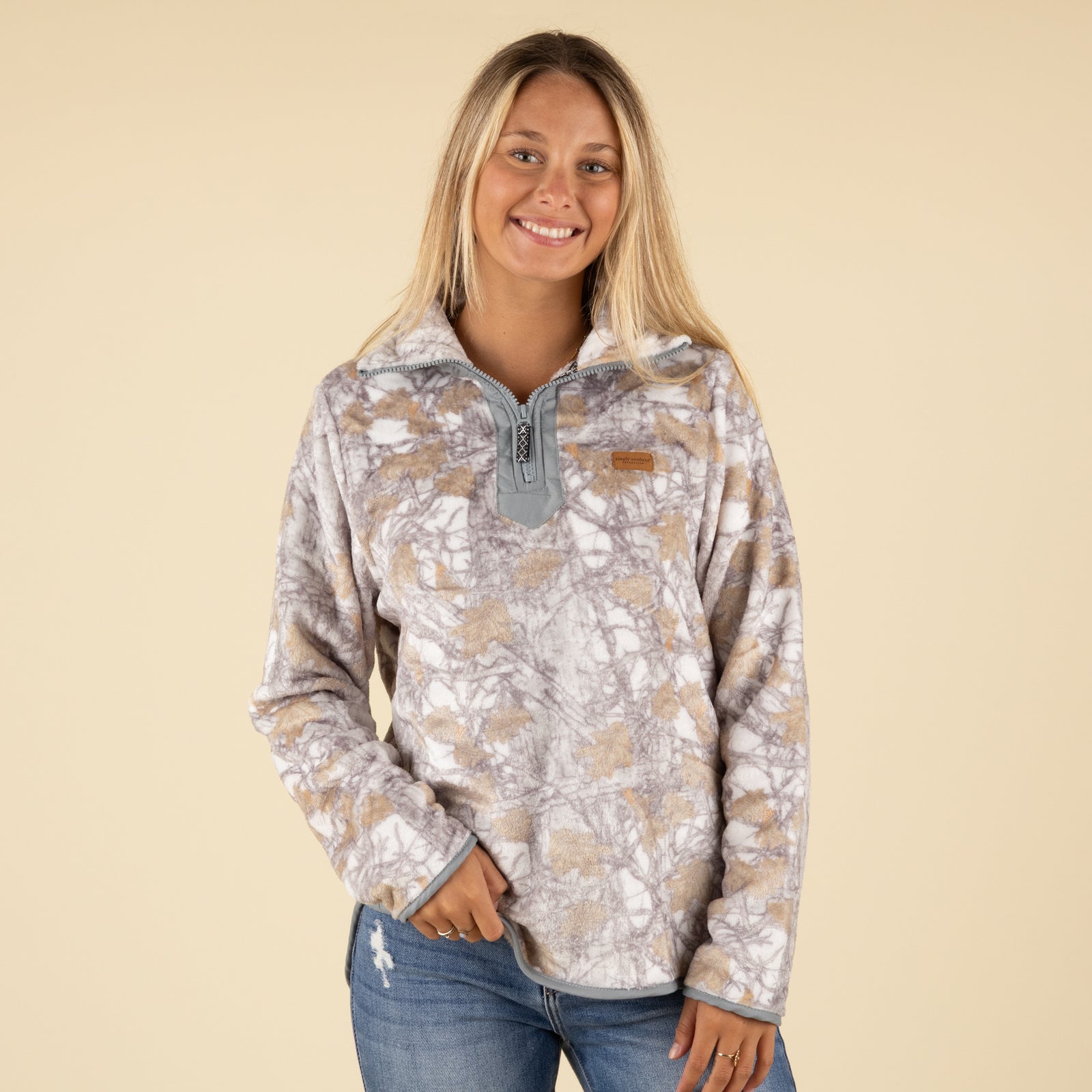 Front view of Simply Southern fleece pullover in fall camo print with quarter-zip neckline and logo patch.