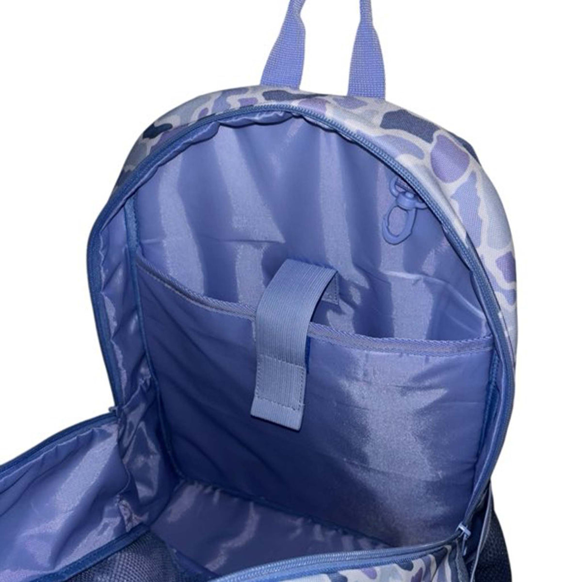 Interior view of the backpack showing the padded laptop sleeve, securing strap, and key clip loop.