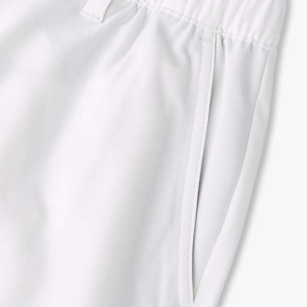 Close-up of white shorts with a plain background