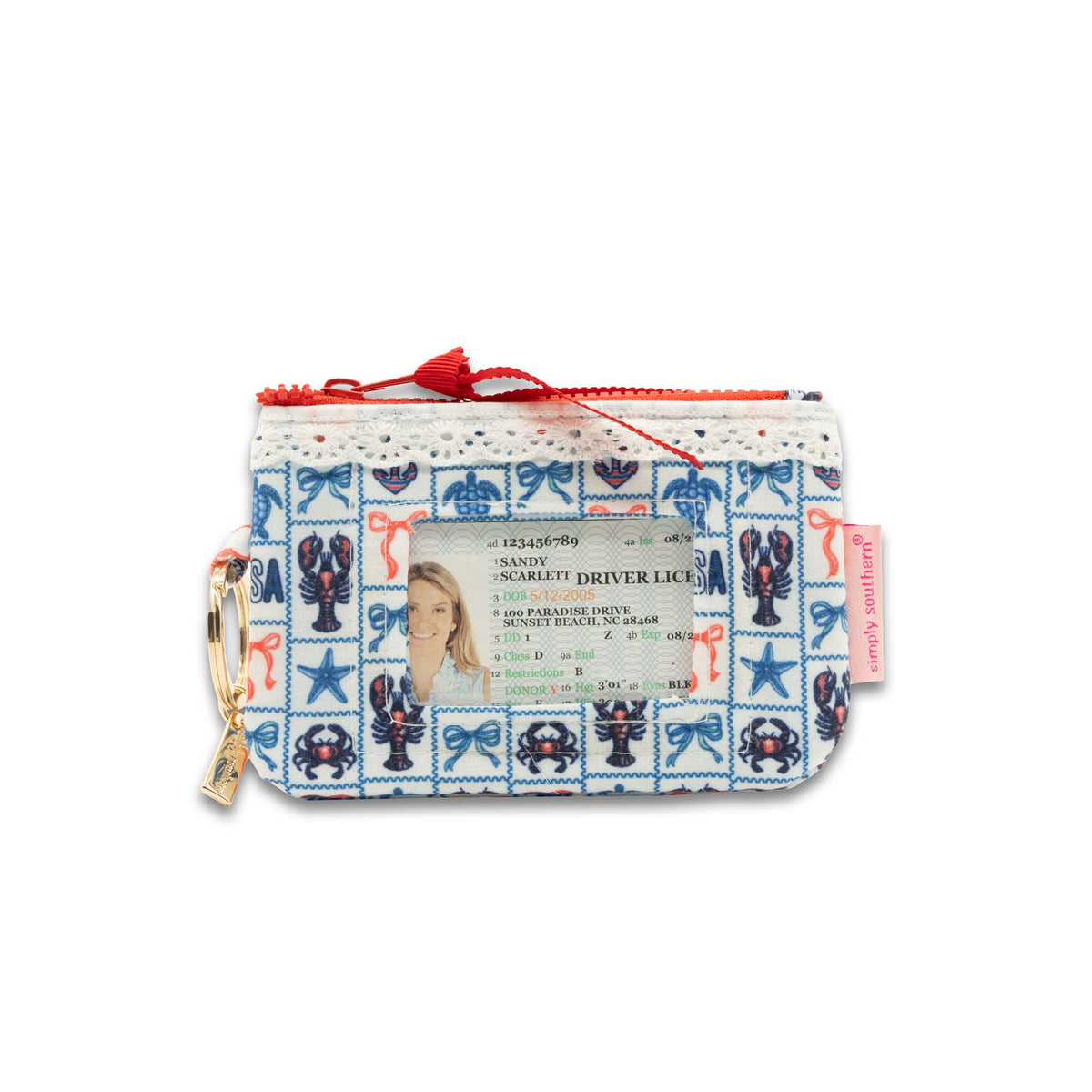 Coastal print lace trim ID zip pouch with lobster, crab, and starfish pattern, back view showing clear ID window with card inside and gold key ring