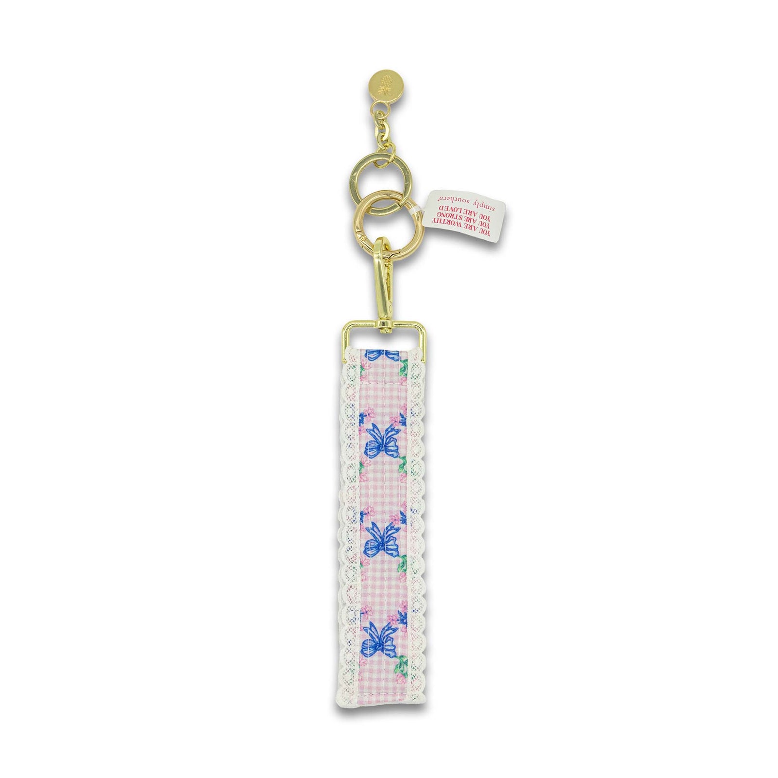 Pink gingham and bow printed keychain with lace trim.