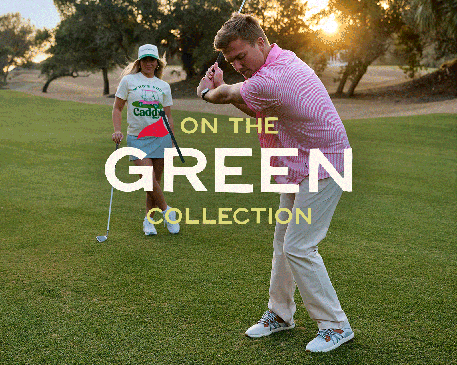 On the Green Collection hero image featuring a man in a pink striped golf polo mid-swing on a golf course while a woman in a graphic caddy t-shirt and skort stands behind him with a golf club at sunset.