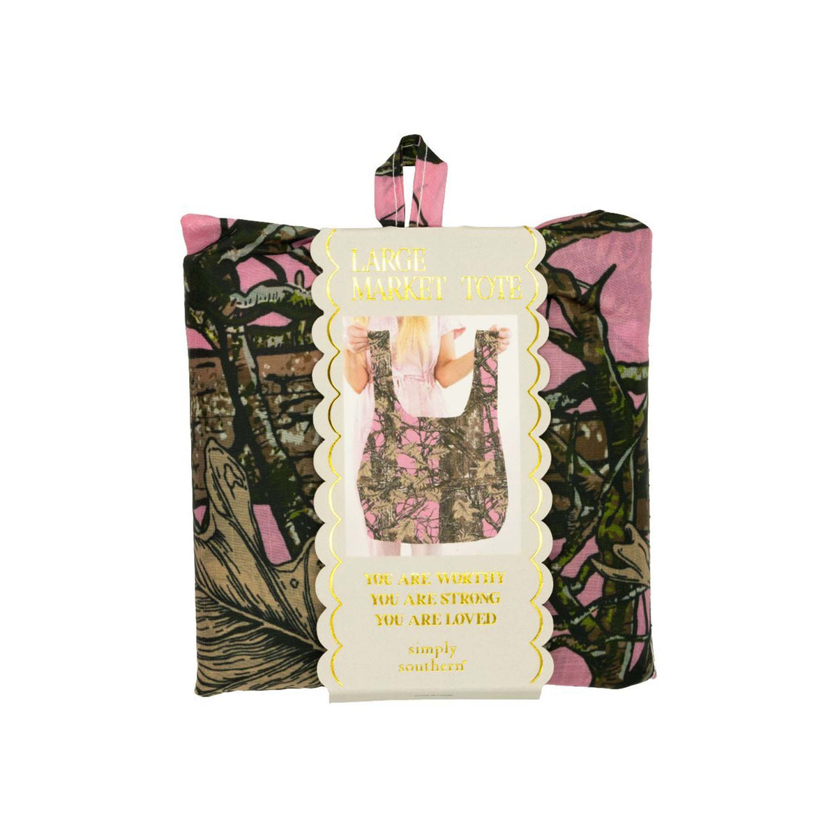 Simply Southern Large Market Tote in pink camouflage print, shown folded in packaging with gold scalloped label and inspirational quote.