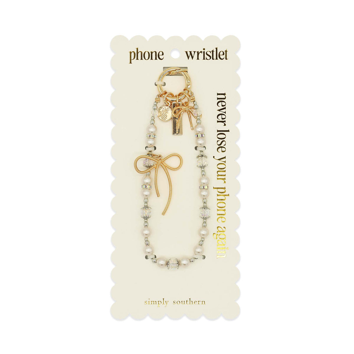 Simply Southern white pearl beaded phone wristlet with gold bow charm on display card.