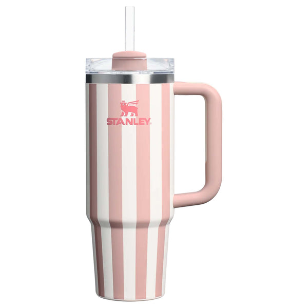 Stanley 30oz handled tumbler in Peach Whip Cabana, a pastel peach-colored stainless steel tumbler featuring a sturdy ergonomic handle, a clear lid, and a reusable straw.
