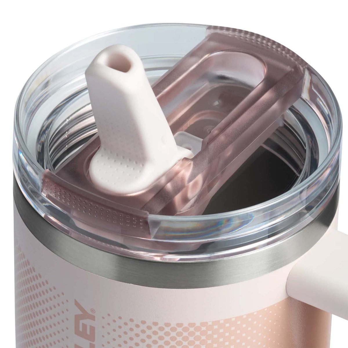 Close-up of Stanley Quencher lid in Rose Quartz Fade showing the raised white straw and pink-toned rotating cover.