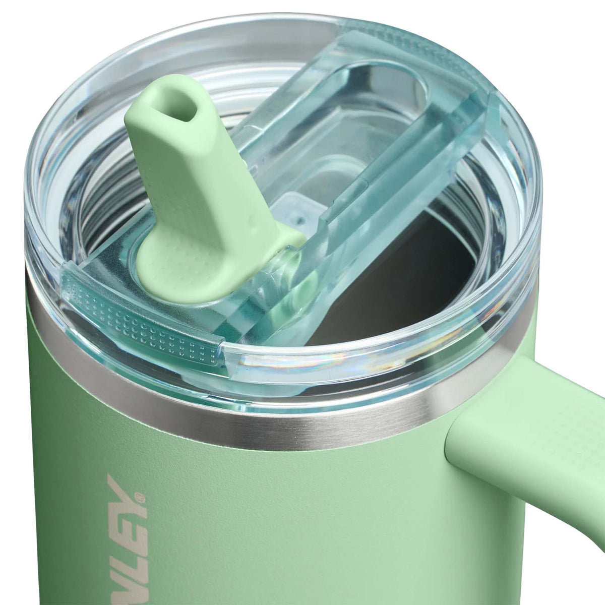 Close-up of Stanley Quencher H2.0 FlowState Tumbler in Pistachio showing clear lid and flip straw detail.