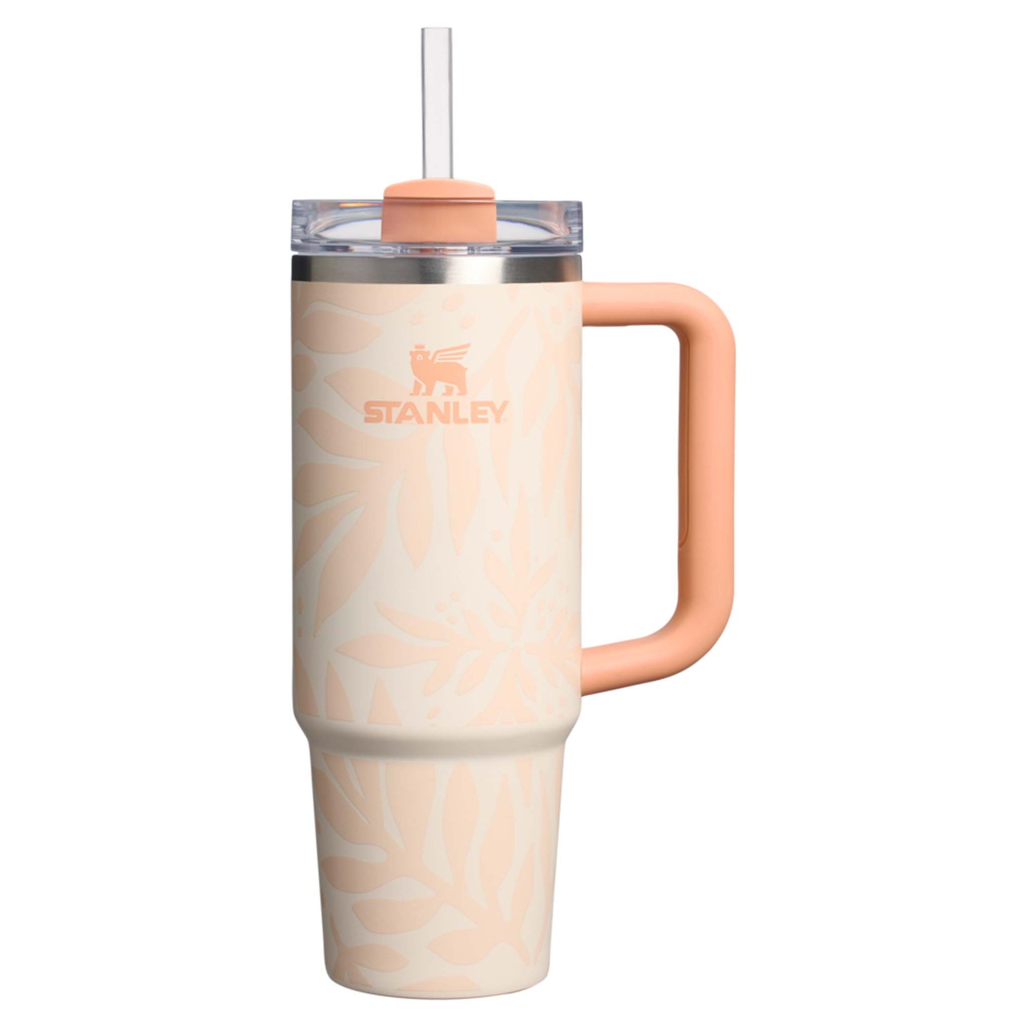 Stanley mug with peach handle and lid on a white background