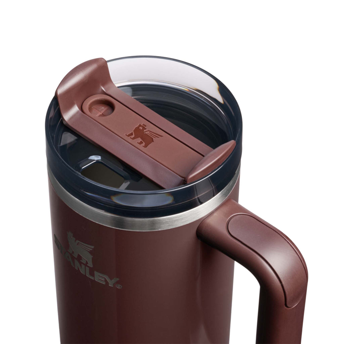 Deep maroon Stanley travel mug with clear lid on a white background