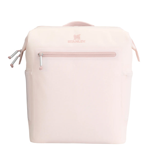 tanley Madeline Midi Backpack Cooler in Rose Quartz shown standing upright. The cooler features a soft pink exterior, adjustable padded backpack straps, a front zippered pocket, and a top handle. Designed for portability and insulation, it is photographed in a studio with a neutral background.