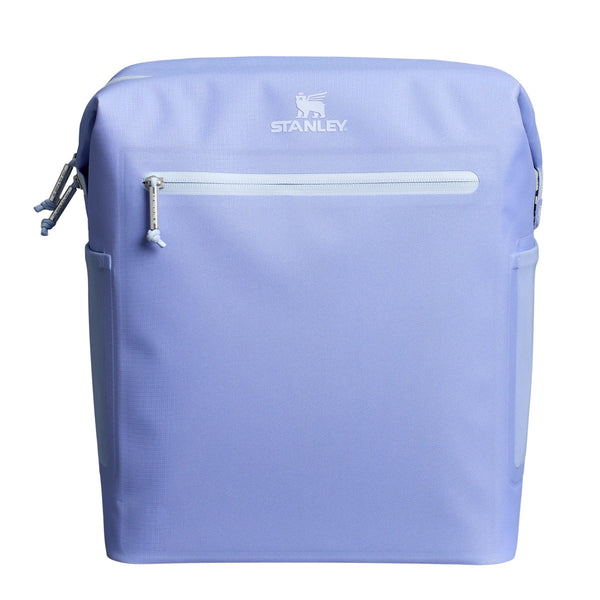 Stanley Madeline Midi Backpack Cooler in Hydrangea shown standing upright. The cooler features a soft purple exterior, adjustable padded backpack straps, a front zippered pocket, and a top handle. Designed for portability and insulation, it is photographed in a studio with a neutral background.