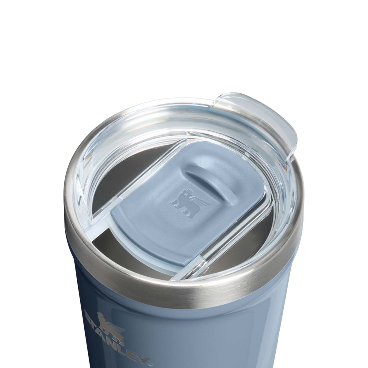 Close-up top view of Stanley 10 oz Everyday Tumbler in Tempest Gloss showing the clear lid with light blue slide closure and stainless steel rim.