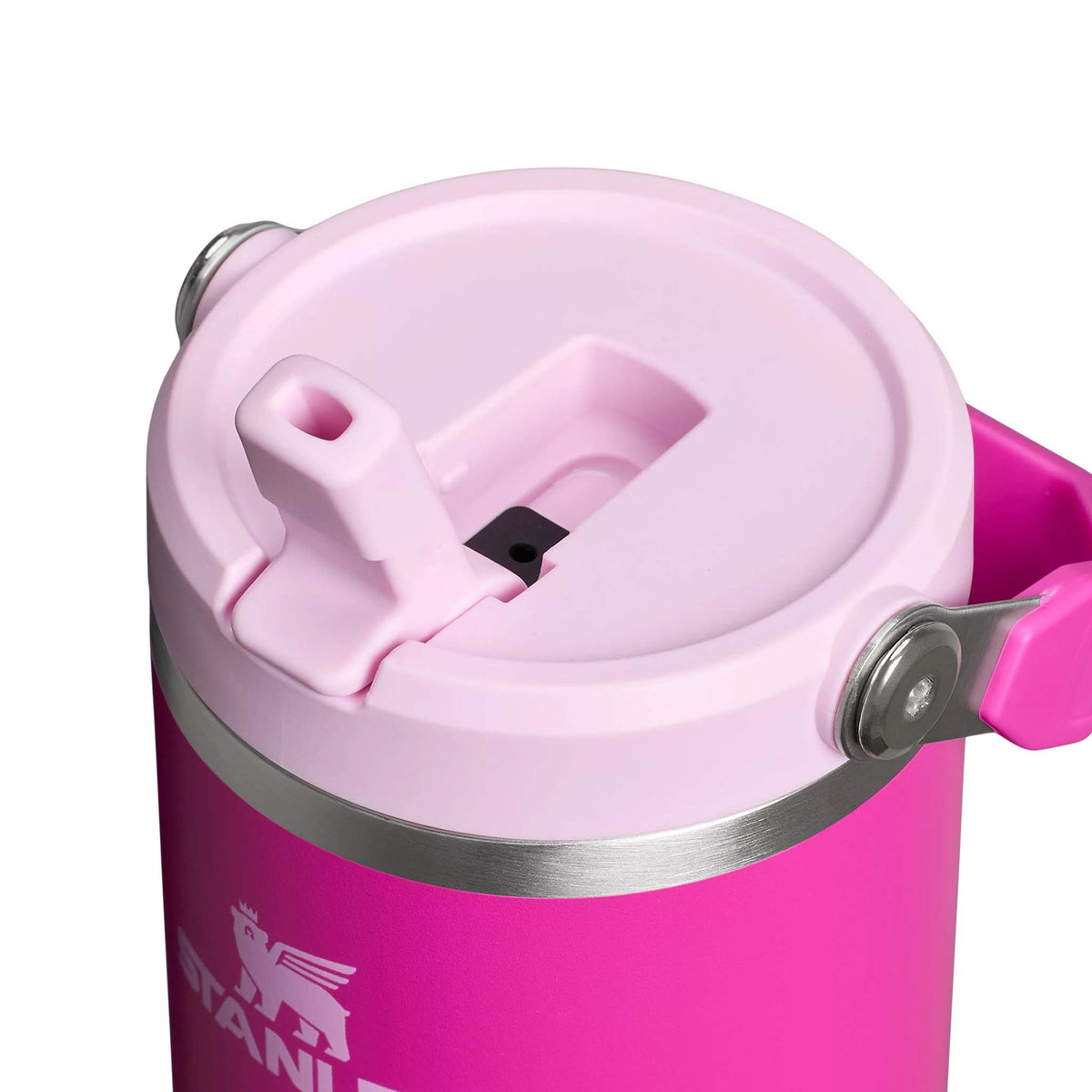 Close-up of Stanley Violet Blossom Quencher tumbler lid with light pink flip straw and stainless steel trim.