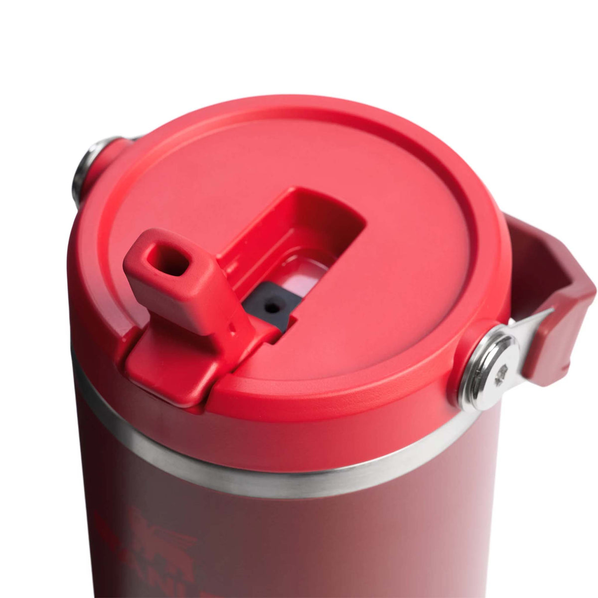 Close-up of Stanley Cranberry Quencher tumbler lid with bright red flip straw and stainless steel trim.