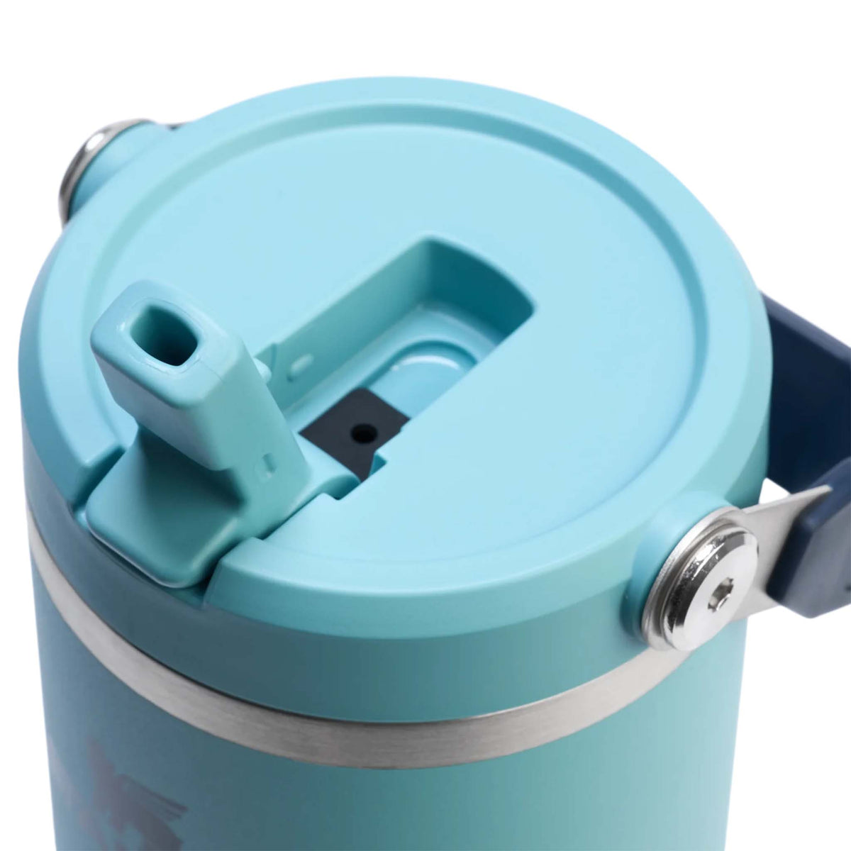 Close-up of the Stanley 30oz The IceFlow Flip Straw Tumbler in Agave showing raised flip straw spout and leak-resistant lid with metal carry handle attachments.