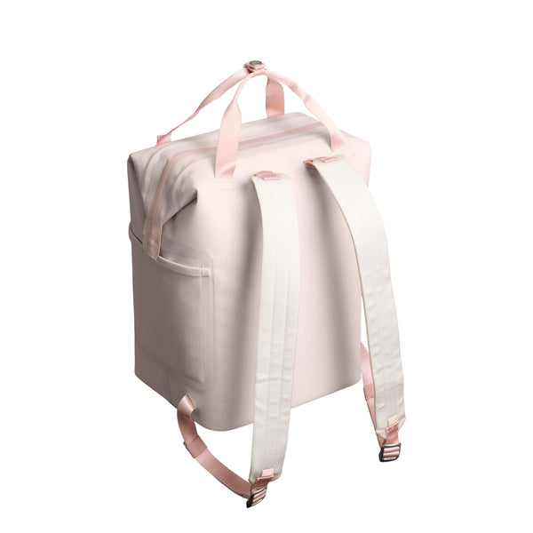 Stanley Madeline Mini Backpack Cooler in Rose Quartz shown standing upright. The compact cooler features a soft pink exterior, adjustable padded backpack straps, a front zippered pocket, and a top carry handle. Designed for lightweight portability and insulation.
