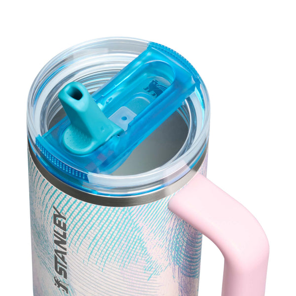 Stainless steel tumbler with blue lid and pink handle on a white background