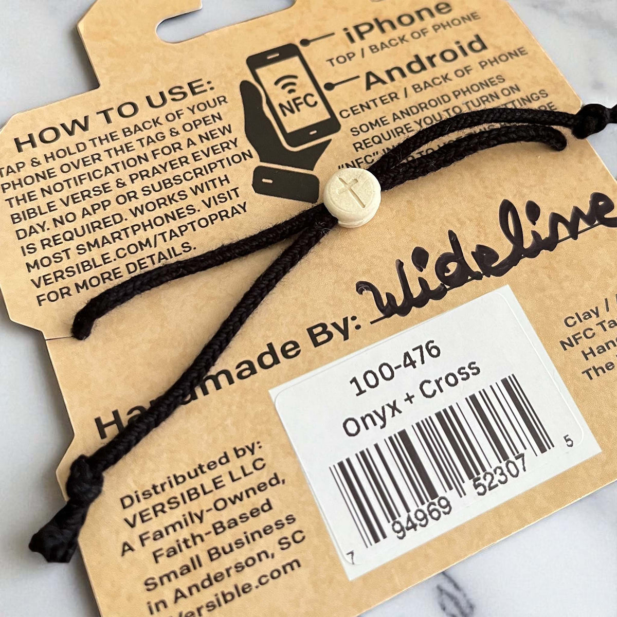 Bracelet with a bar code label on aVersible branded card