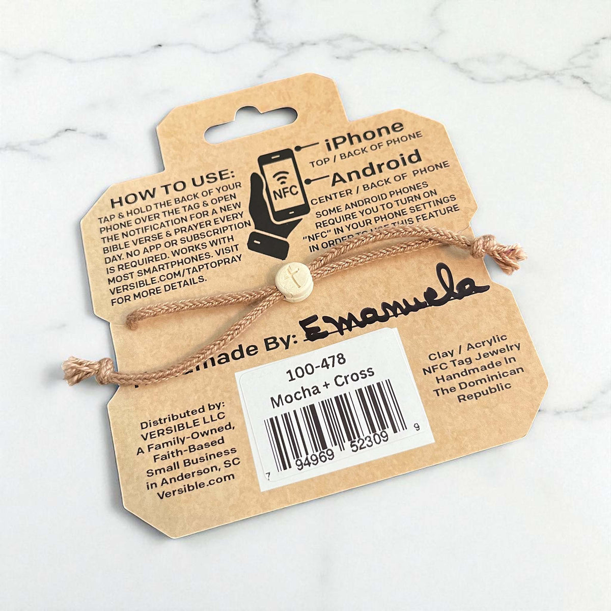 NFC tag jewelry with a label on a marble surface