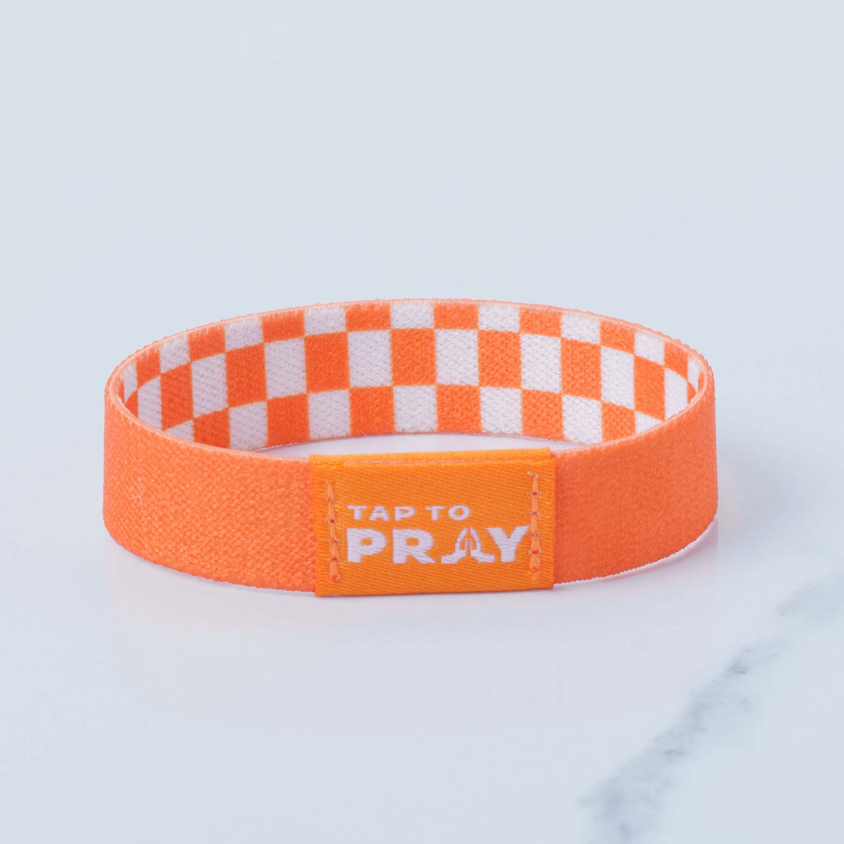 Tap To Pray Wristband in Orange and White checkered