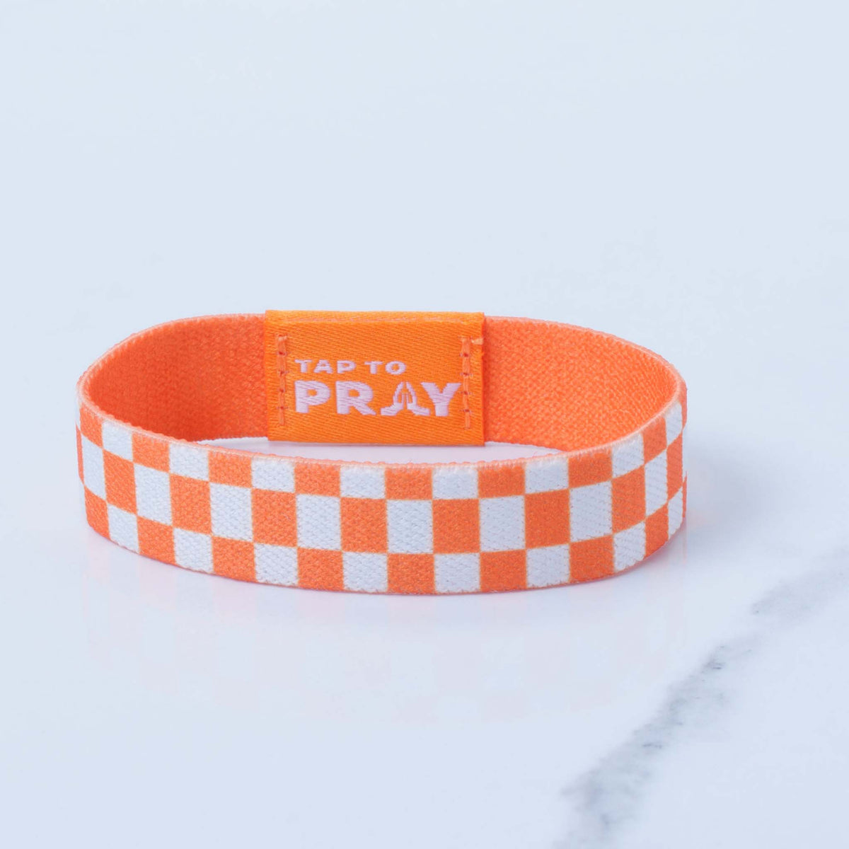 Tap To Pray Wristband in Orange and White checkered