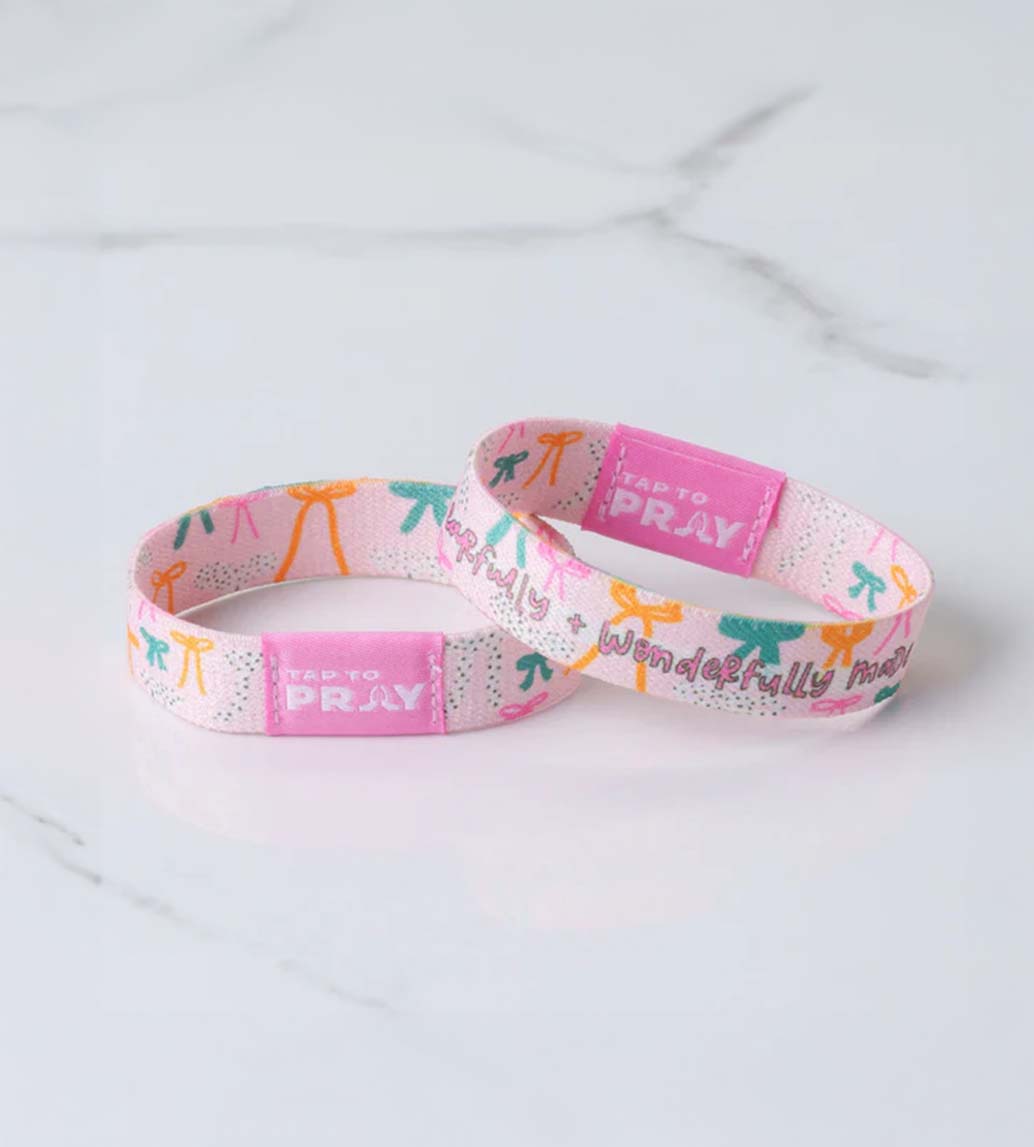 Versible Tap To Pray Wristband in Pink Bows