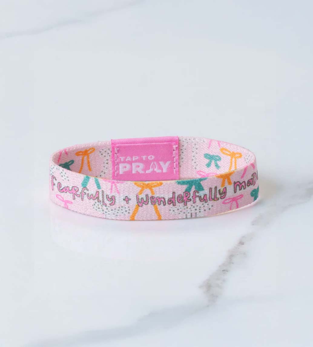 Versible Tap To Pray Wristband in Pink Bows