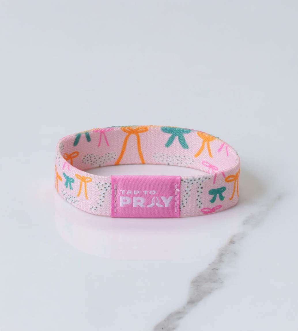 Versible Tap To Pray Wristband in Pink Bows