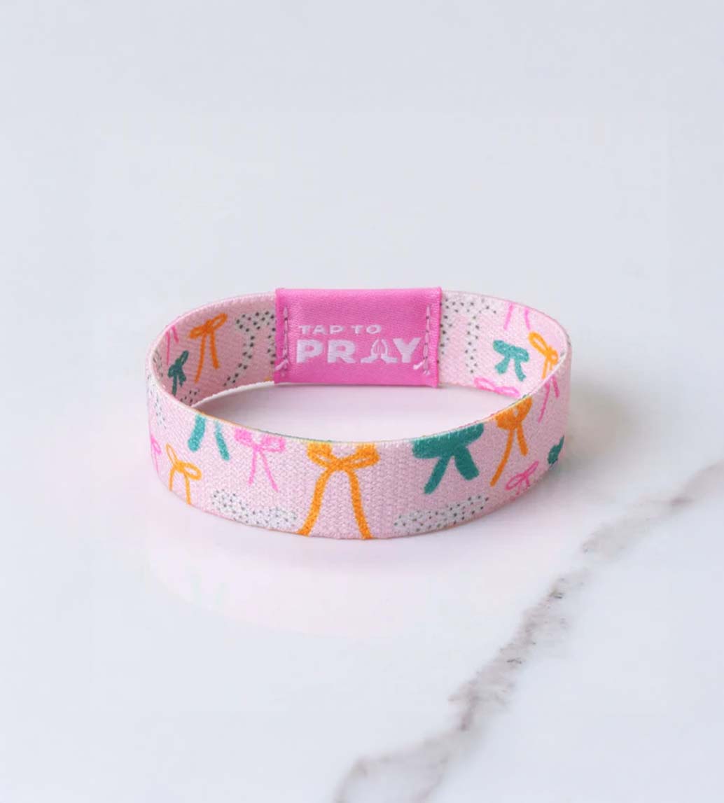 Versible Tap To Pray Wristband in Pink Bows