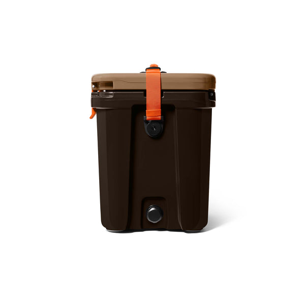Side view of YETI Roadie 24 Hard Cooler in Wetlands Camo colorway with orange strap, drain plug, and tan lid closed.