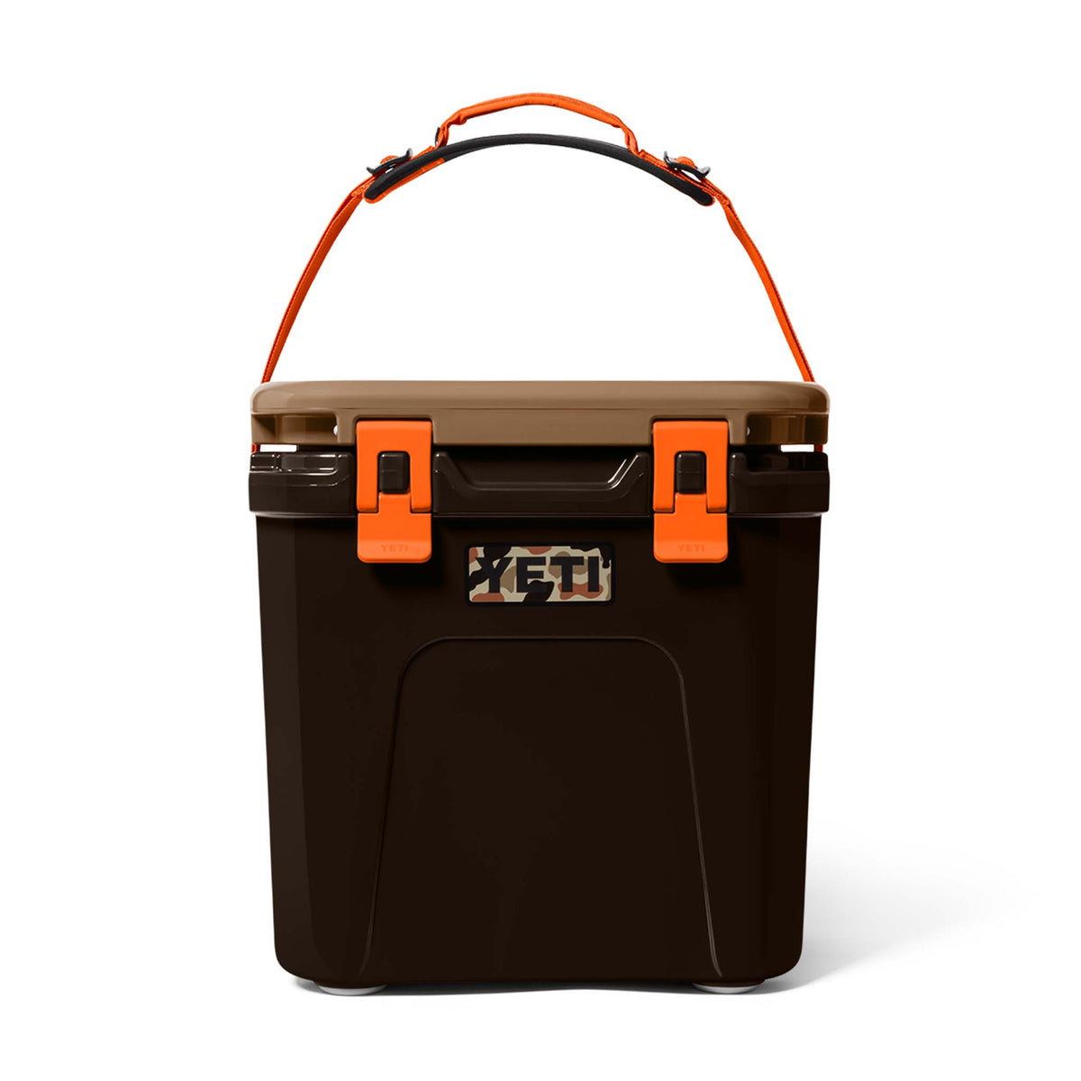 Front view of YETI Roadie 24 Hard Cooler in Wetlands Camo colorway with orange strap and tan lid closed.