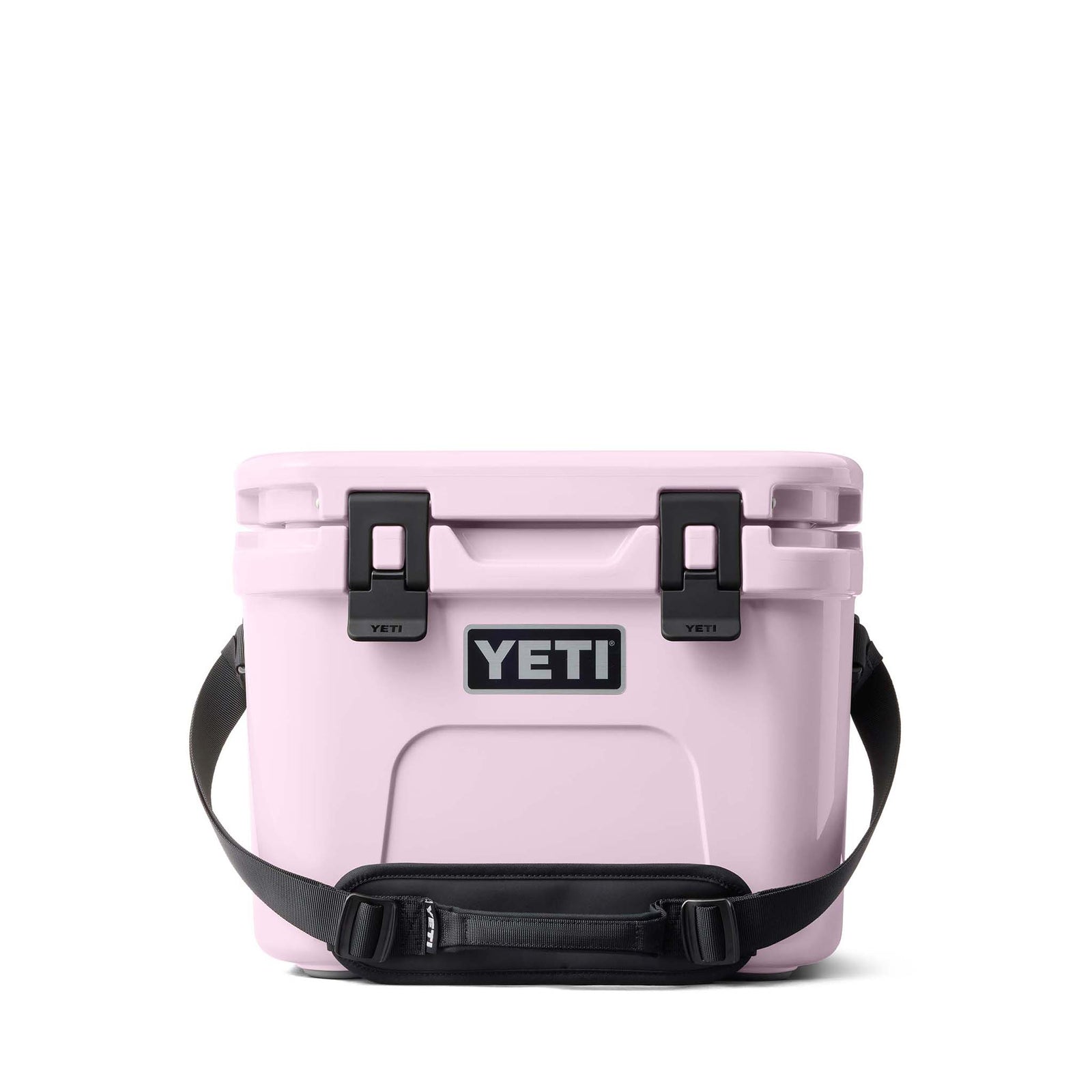 Front view of the YETI Roadie 15 Cooler in Cherry Blossom with closed lid, latches, and padded shoulder strap.