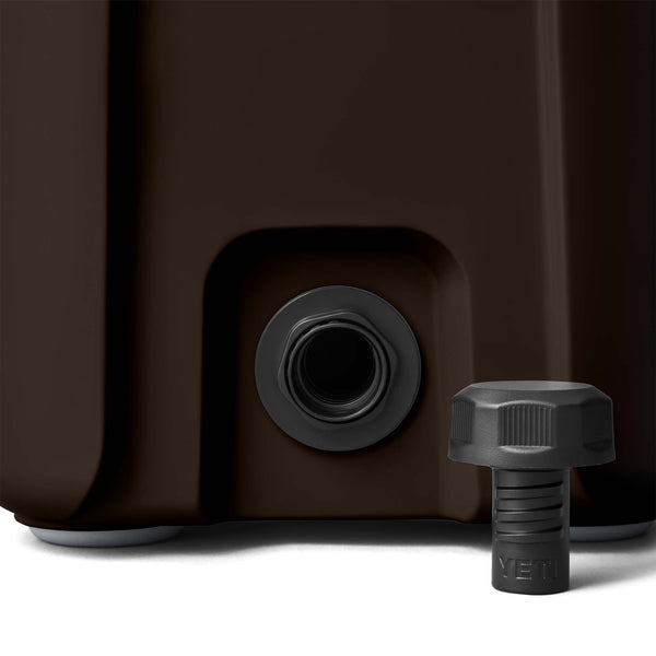 Close-up of screw cap drain plug on bottom corner of the cooler with removable black YETI plug.