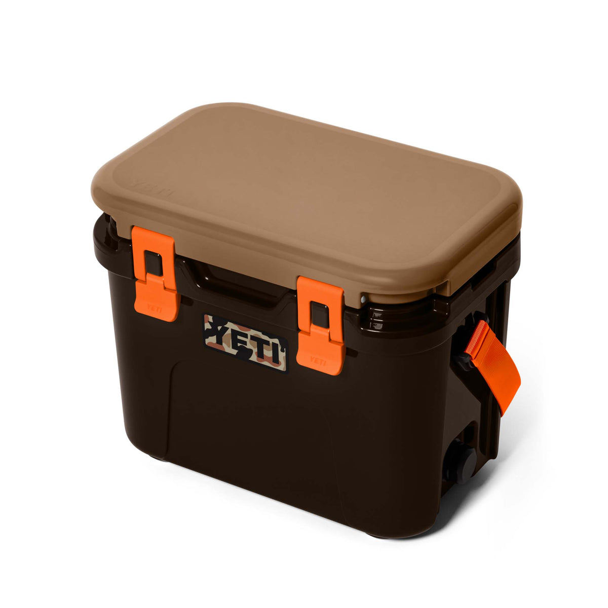 Angled side view of the YETI Roadie 15 Hard Cooler in Wetlands Camo showing carry strap and camo YETI logo.