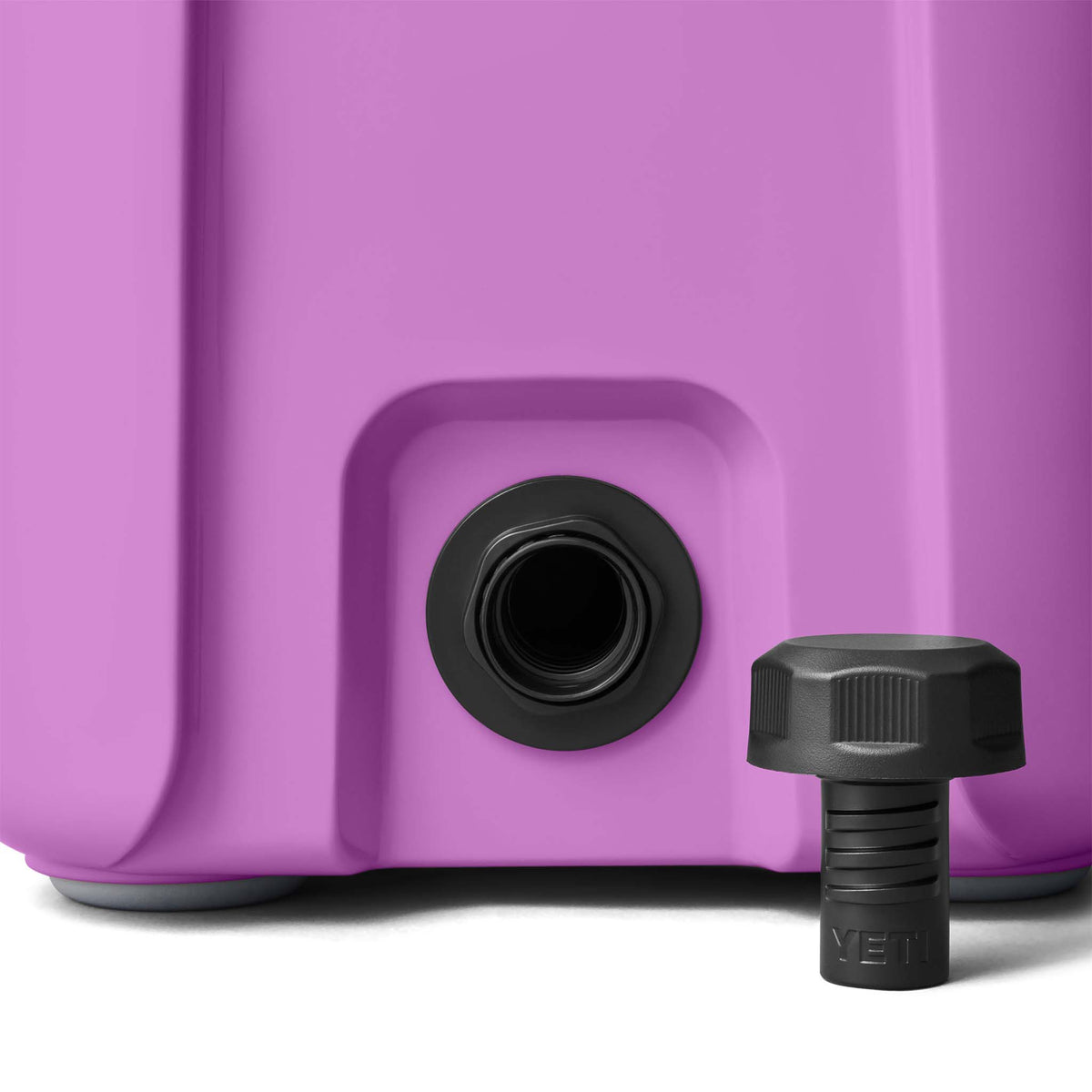 Purple YETI cooler with black straps on a white background