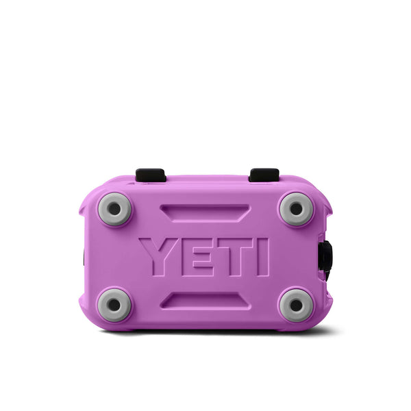 Purple YETI cooler with black straps on a white background