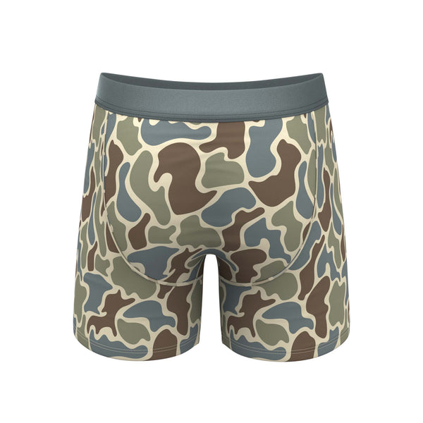 Back view of camo print boxer briefs with curved panel seam and tonal waistband.