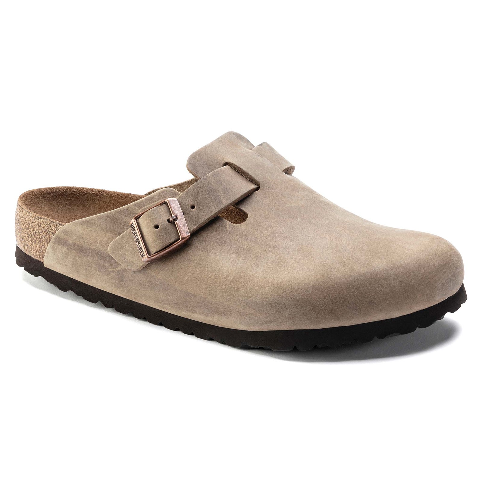 Side view of Birkenstock Boston Soft Footbed clogs in Tobacco leather with contoured cork footbed and bronze buckle.