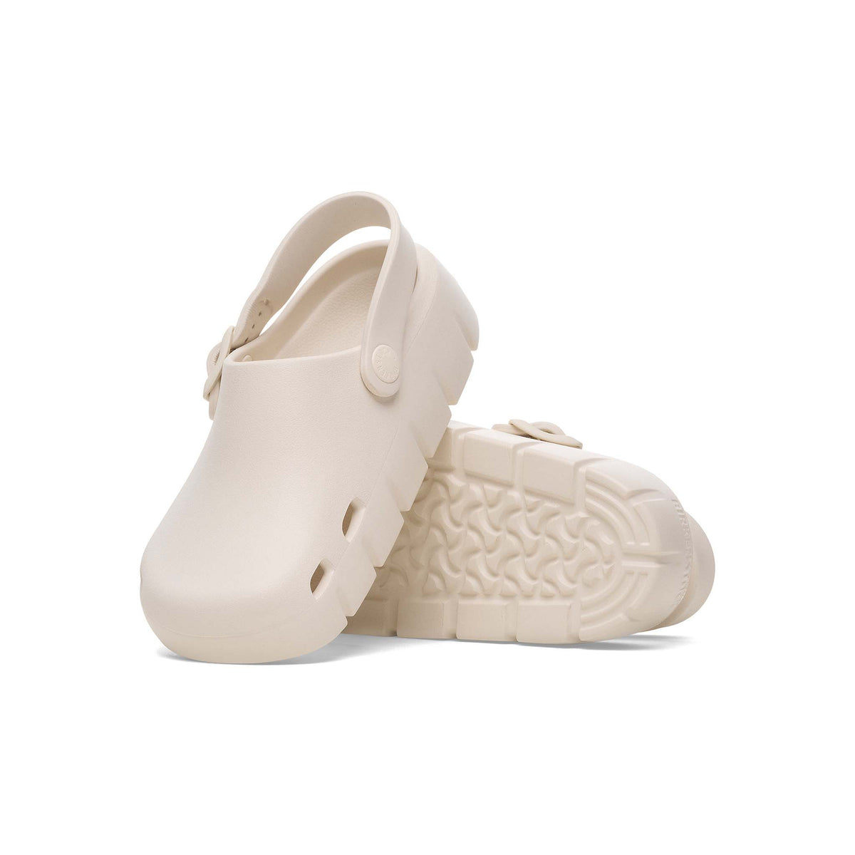 Off white youth clog shoe by Birkenstock a white background