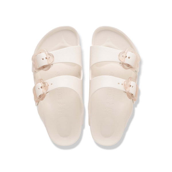 Birkenstock Youth Arizona Flower EVA in Eggshell with clear flower buckles shown on a white background.