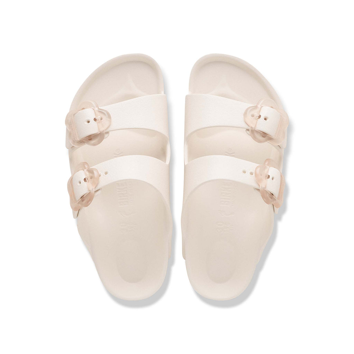 Birkenstock Youth Arizona Flower EVA in Eggshell with clear flower buckles shown on a white background.