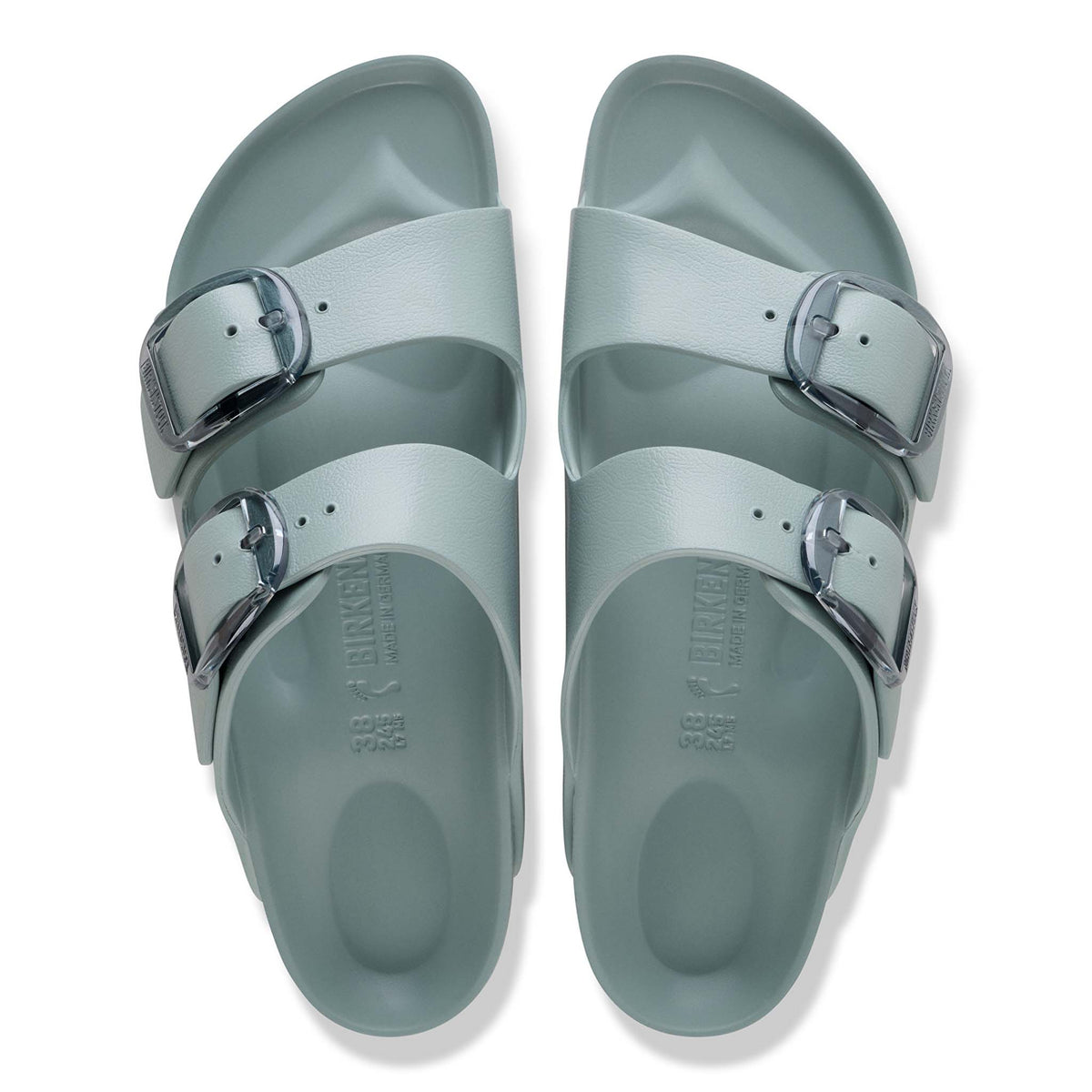 Top-down view of Birkenstock Arizona EVA sandals in Pure Sage showing contoured footbeds, double adjustable straps, and translucent oversized buckles.