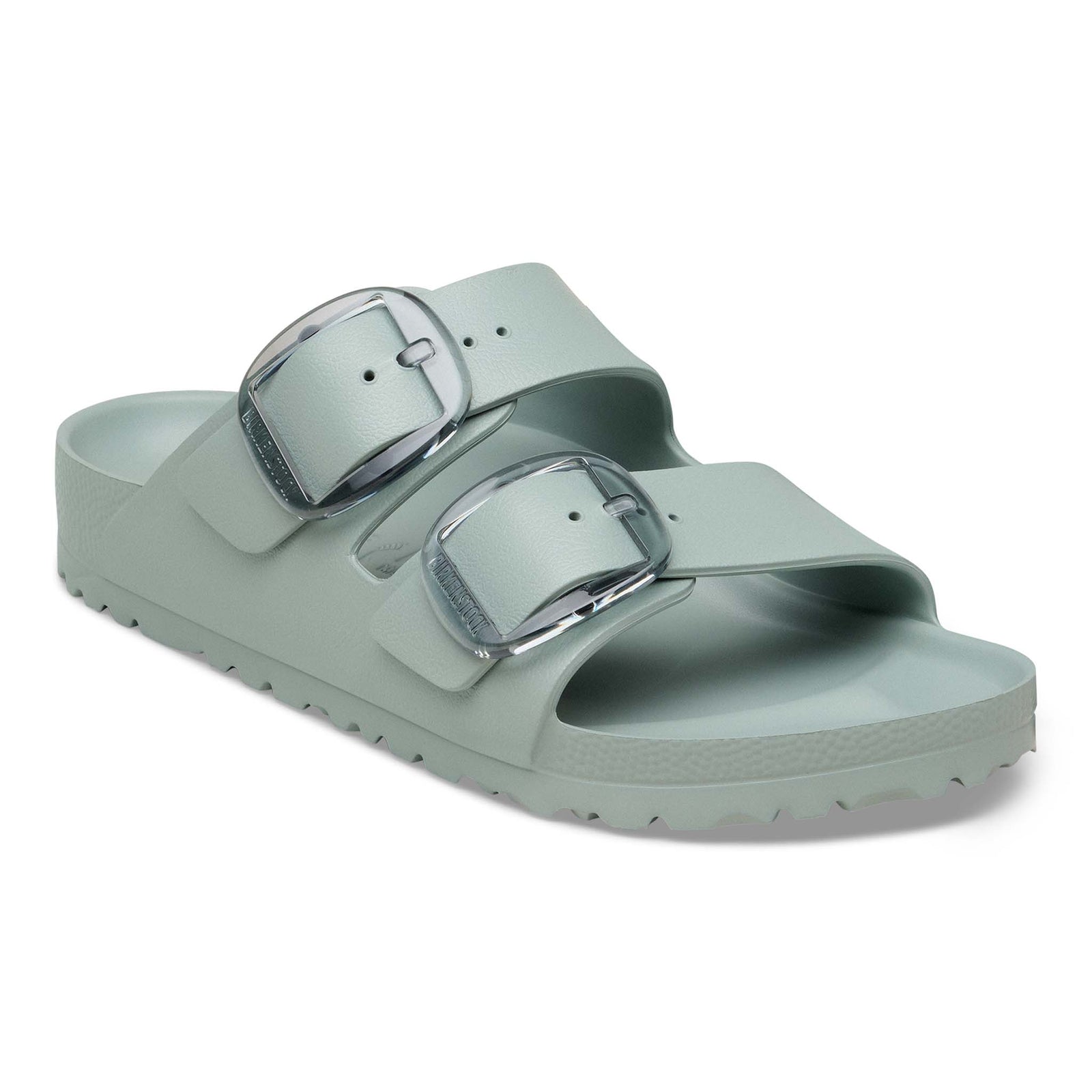 Birkenstock Arizona EVA sandals in Pure Sage with two adjustable straps and translucent oversized buckles, angled product view on a white background.