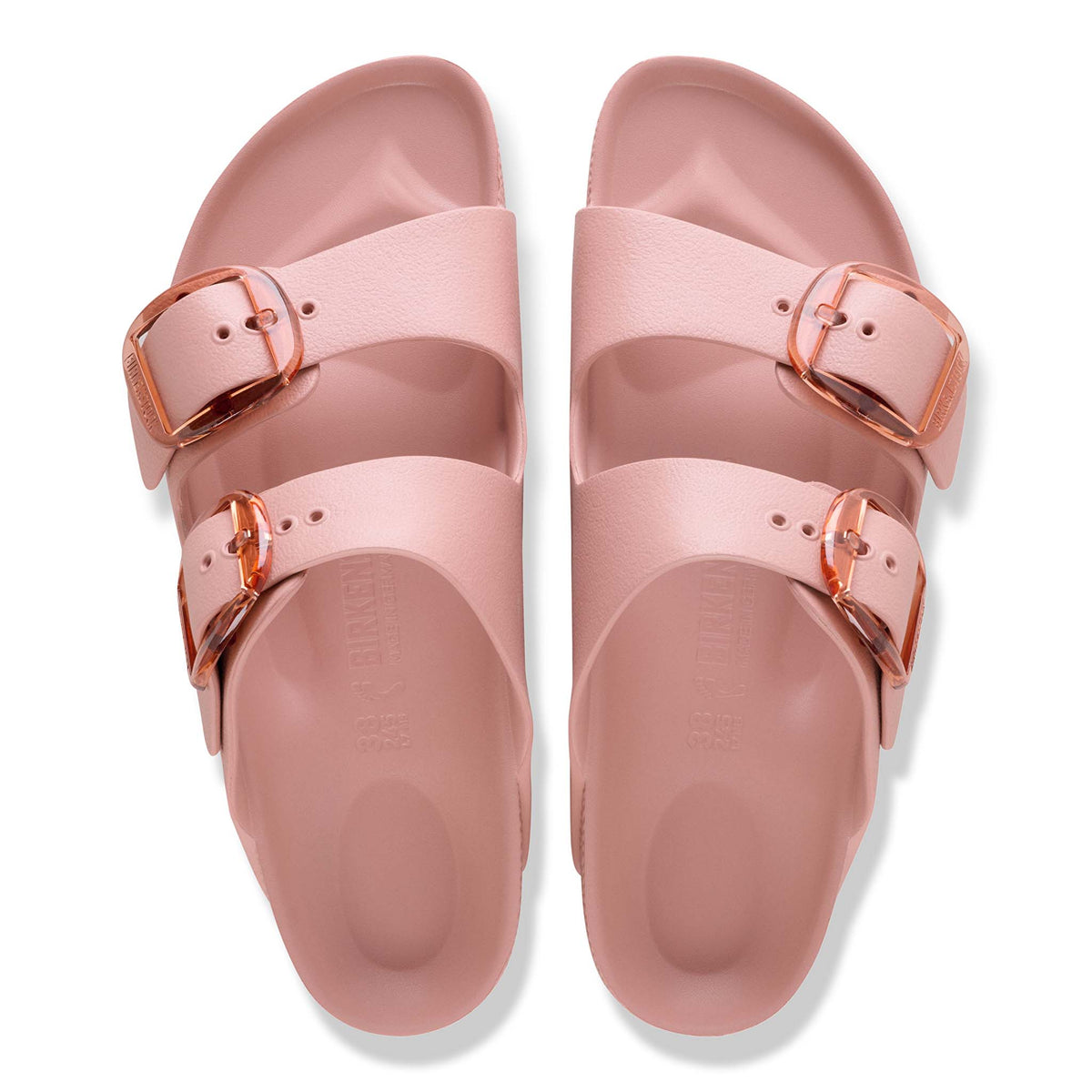 Top-down view of Birkenstock Arizona EVA sandals in Pink Clay with double adjustable straps, contoured footbeds, and translucent oversized buckles.