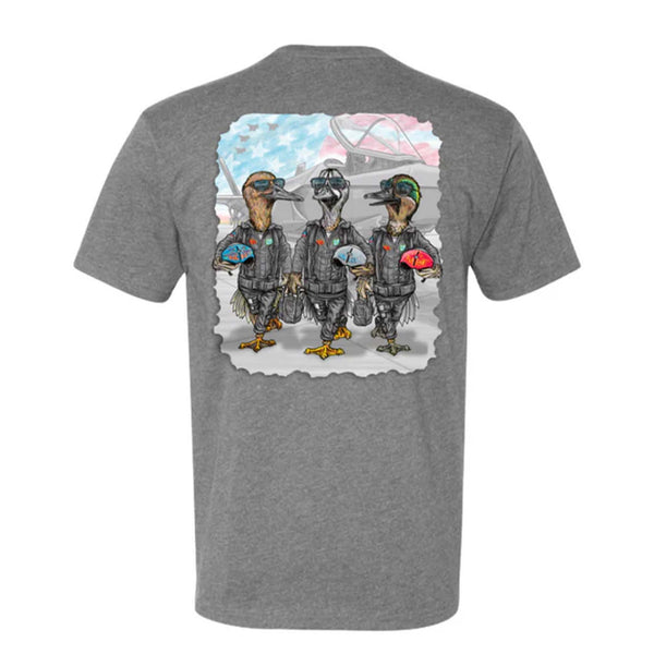 Combat Waterfowl Twisted Teal Short SLeeve T-shirt, color dark heather grey, sizes S-XXXL, unisex sizing
Back view of a heather gray Combat Waterfowl t-shirt featuring a colorful graphic of three cartoon-style ducks dressed as fighter pilots. Each duck wears a black flight suit and holds a decorated helmet. The background shows a hangar scene with fighter jets and a stylized American flag in red, white, and blue.
