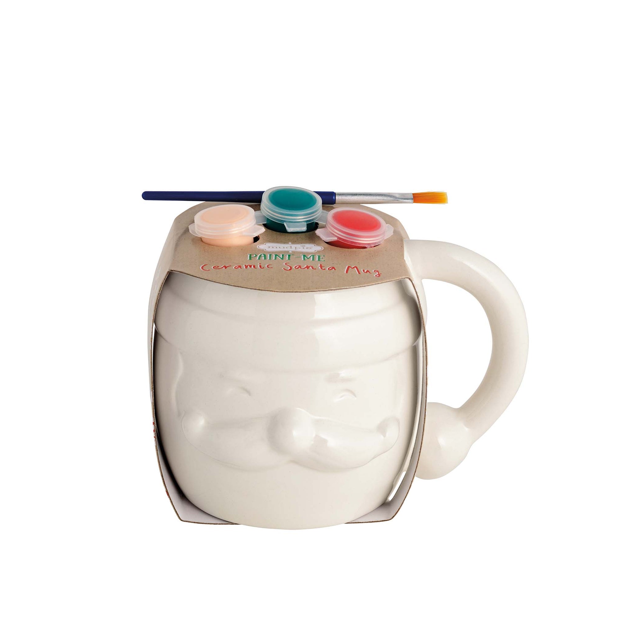 Mud Pie DIY Santa Paint Mug with paint set and brush on top of ceramic Santa face mug.