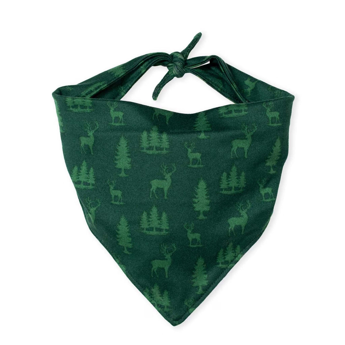 Green dog bandana with forest tree and deer print, tied at the top for adjustable fit.