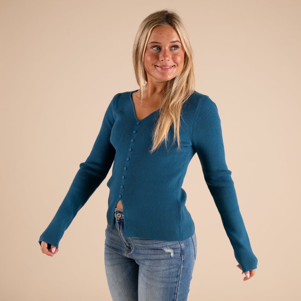 Very J Grey Ribbed V-neck Button Down Long Sleeve Sweater on model paired with medium wash denim jeans